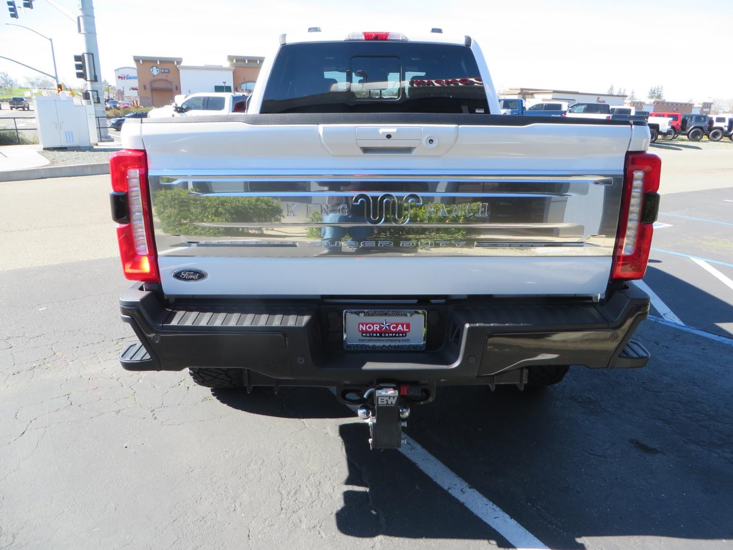 2024 White /BROWN Ford F-250 SD King Ranch Crew Cab 4WD (1FT8W2BM0RE) with an 6.7 HI OUTPUT POWER STROKE engine, 10-SPEED AUTO TORQSHIFT transmission, located at 2630 Grass Valley Highway, Auburn, CA, 95603, (530) 508-5100, 38.937893, -121.095482 - New 24 King Ranch featuring a BDS 3" radius arm suspension system, Fox 2.5 Performance Elite series shocks, Fox ATS steering stabilizer, 37" Nitto Ridge Grappler tires, 18" Method MR315 wheels, 2wd front bumper valance, B&W Tow and Stow hitch, and a Bolt Lock. - Photo#5